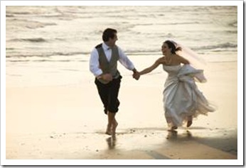 Newly-wed couple on beach