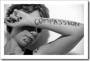 Compassion written on a woman's arm
